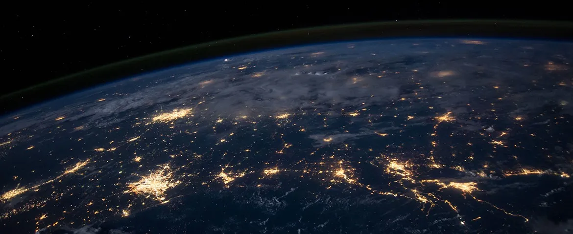 An image of the world connected by lights.